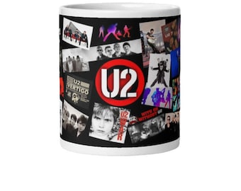 May include: White ceramic mug featuring a collage of images and the band's logo. The design includes black and white photos, album art, and the band's name in a red and white circle. The mug is a fan item.