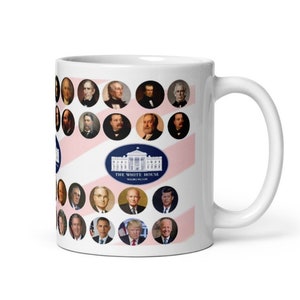 May include: White ceramic mug featuring portraits of U.S. presidents and an image of the White House. The mug has a white handle and a design with red and white stripes. The mug is a standard 11 oz size.