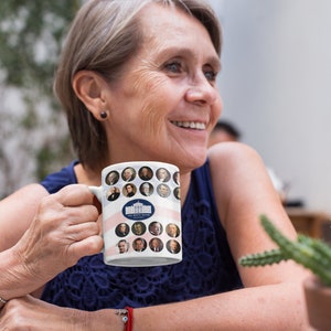 May include: White ceramic mug featuring portraits of U.S. presidents and the White House logo. The mug has a patriotic design with red and white stripes. The mug is held by a person.