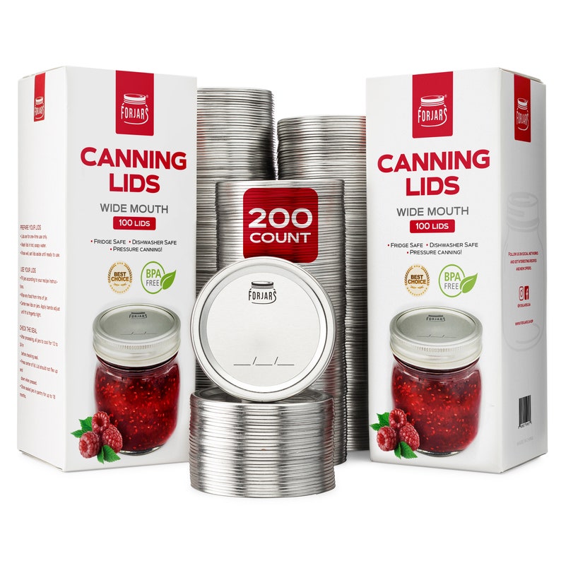 May include: A stack of 200 silver canning lids, with a box of canning lids on either side. The boxes are white with red text that reads "Canning Lids Wide Mouth 100 Lids". The boxes also have a red "Best Choice" and "BPA Free" label.