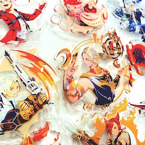 May include: A collection of colorful acrylic charms featuring anime-style characters. The charms showcase various characters in dynamic poses, with vibrant colors and detailed designs. The image includes a variety of character designs, with a focus on fantasy themes.