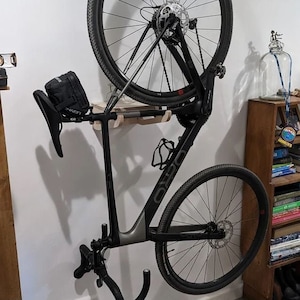 Yes! you can hang the bike vertically!