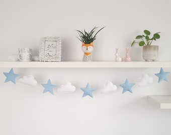 Garland with stars and clouds in a velvet blue color: wall decoration for a children’s room