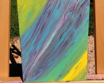 May include: Abstract painting on canvas with streaks of yellow, green, blue, and purple paint.