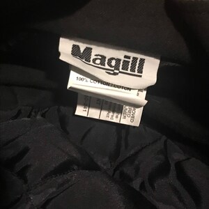 May include: A black Magill brand work jacket with a label that reads "100% Cotton/Coton" and "60-241".