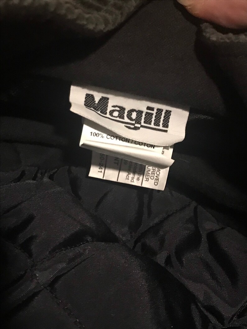 May include: A black Magill brand work jacket with a label that reads "100% Cotton/Coton" and "60-241".