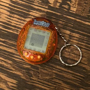 Tamagotchi Connection V1 Translucent Sparkling Orange 2004 Bandai Wiz Orange Glitter Tamagotchi