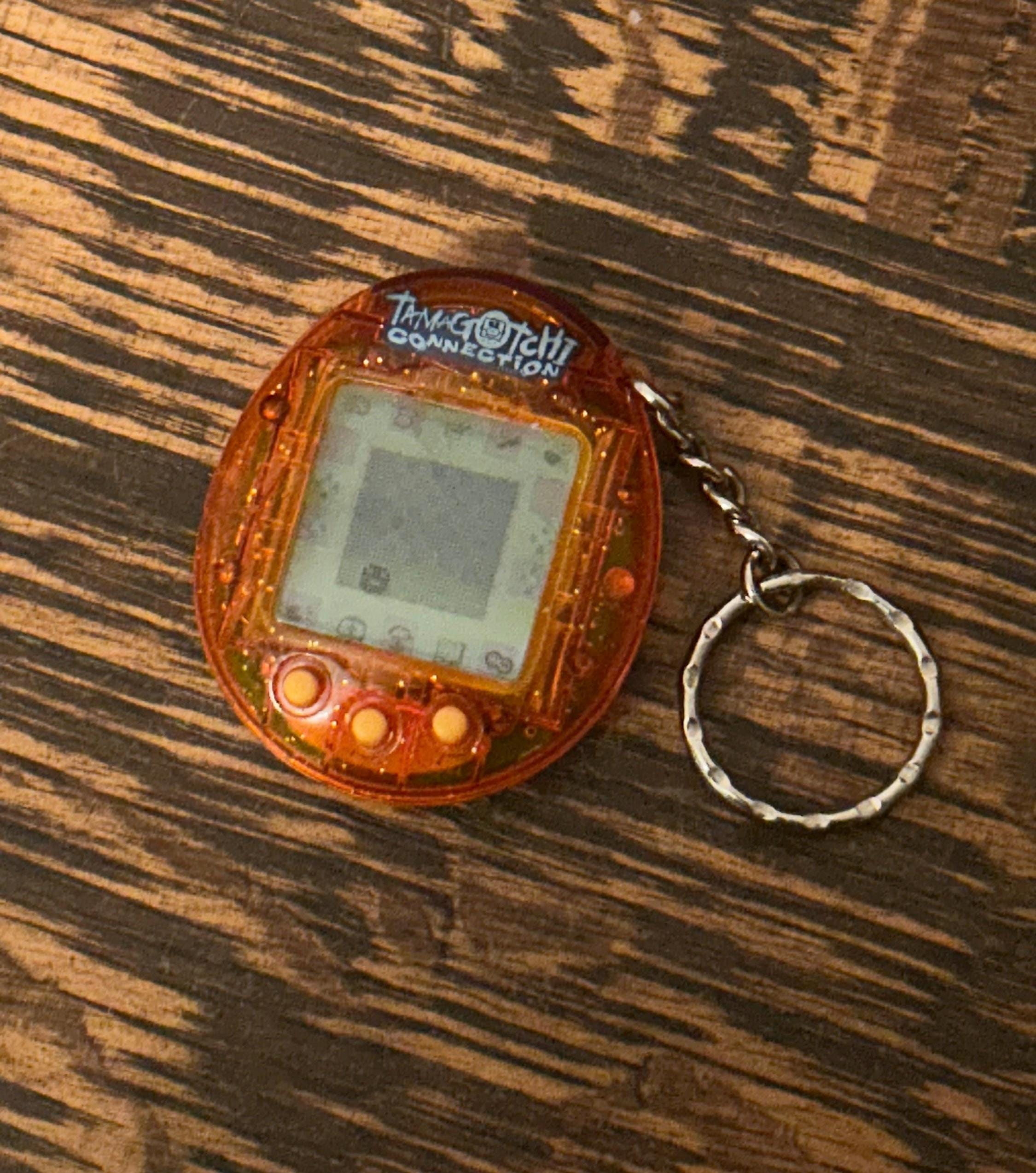 Tamagotchi Connection V1 Translucent Sparkling Orange 2004