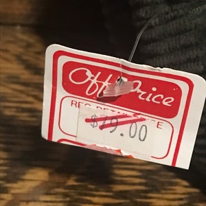 May include: A white price tag with red text that reads "Off Price" and "Reg Retail &pound;19.00".