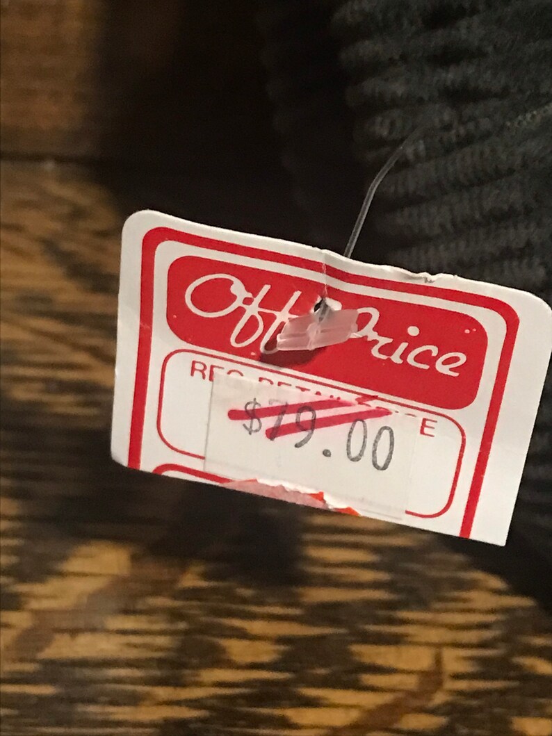 May include: A white price tag with red text that reads "Off Price" and "Reg Retail &pound;19.00".