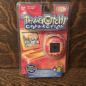Tamagotchi Connection V3 Orange Flowers Bandai Wiz 2006 Sealed Tamagotchi Toy