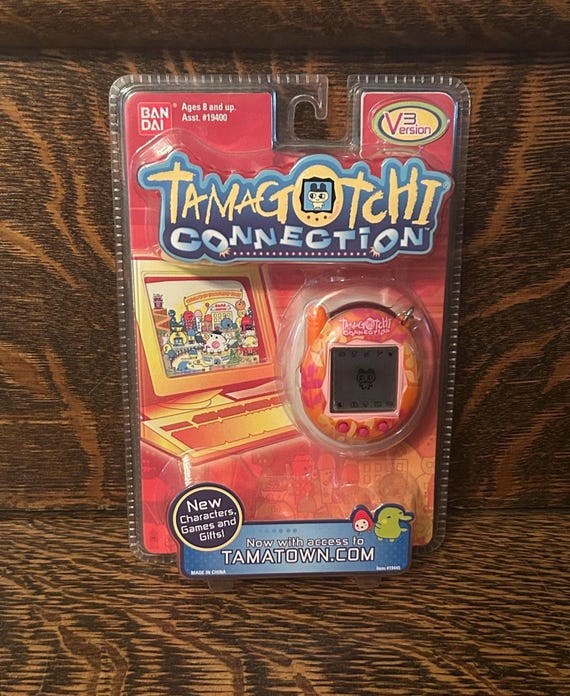 Tamagotchi Connection V3 Orange Flowers Bandai Wiz 2006 Sealed
