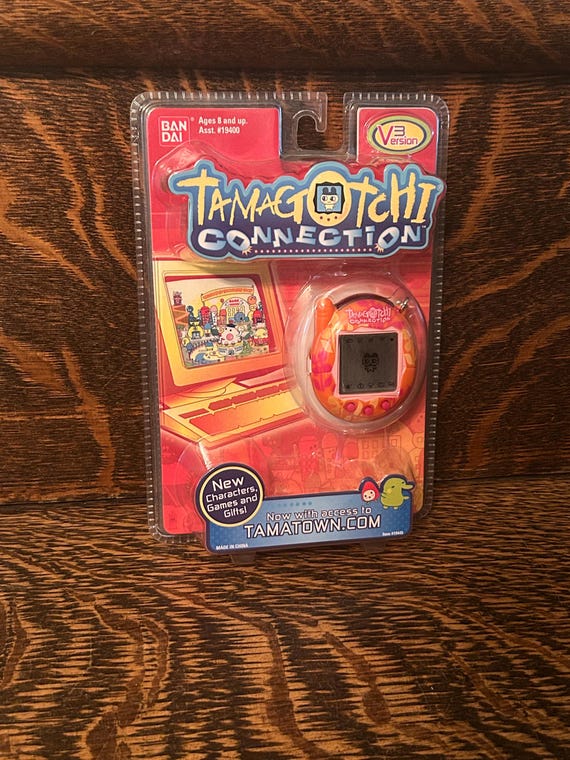 Tamagotchi Connection V3 Orange Flowers Bandai Wiz 2006 Sealed