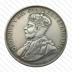 May include: A silver coin featuring a profile of a crowned man with a beard, surrounded by text. The coin has a detailed design with intricate patterns and lettering. The coin's edge has a textured pattern.