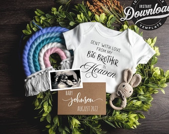 May include: A white onesie with the text "Sent with love from my big brother in Heaven" on it. A brown card with the text "Baby Johnson August 2022" is next to a rainbow-colored yarn wall hanging and a crocheted bunny with a wooden ring.