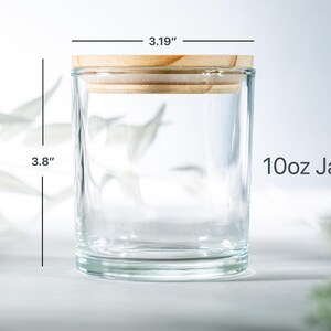 May include: A clear glass jar with a wooden lid. The jar is 3.8 inches tall and 3.19 inches wide. It is labeled "10oz Jar".