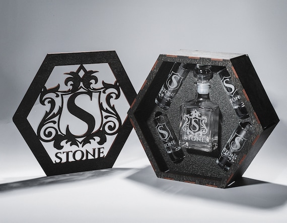 A personalized tequila decanter set with engraved shot glasses in a wooden box — tequila barware is rare in the personalized gift space and 247 favorites signal this fills a real gap.