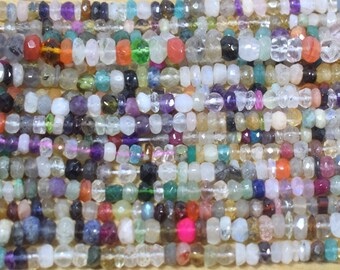 May include: A strand of colorful gemstone beads, featuring a variety of shapes and sizes. The beads are strung on a clear thread and are ready for jewelry making.
