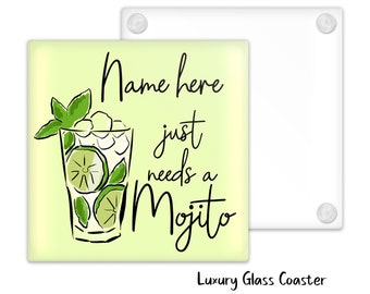 May include: A green and white glass coaster with a drawing of a mojito cocktail and the text "Name here just needs a Mojito".