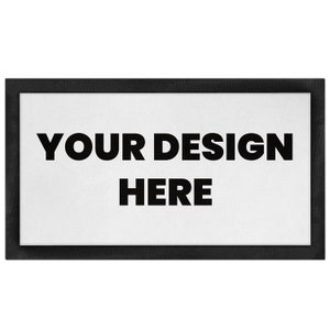 Puede incluir: Una alfombra de bienvenida rectangular de color negro con el texto "YOUR DESIGN HERE" en blanco.