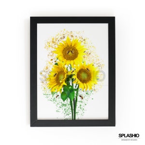 May include: A framed art print featuring three vibrant sunflowers with bees, set against a white background with yellow and green paint splatters. The sunflowers are in full bloom, with bright yellow petals and brown centers. The black frame adds a modern touch.