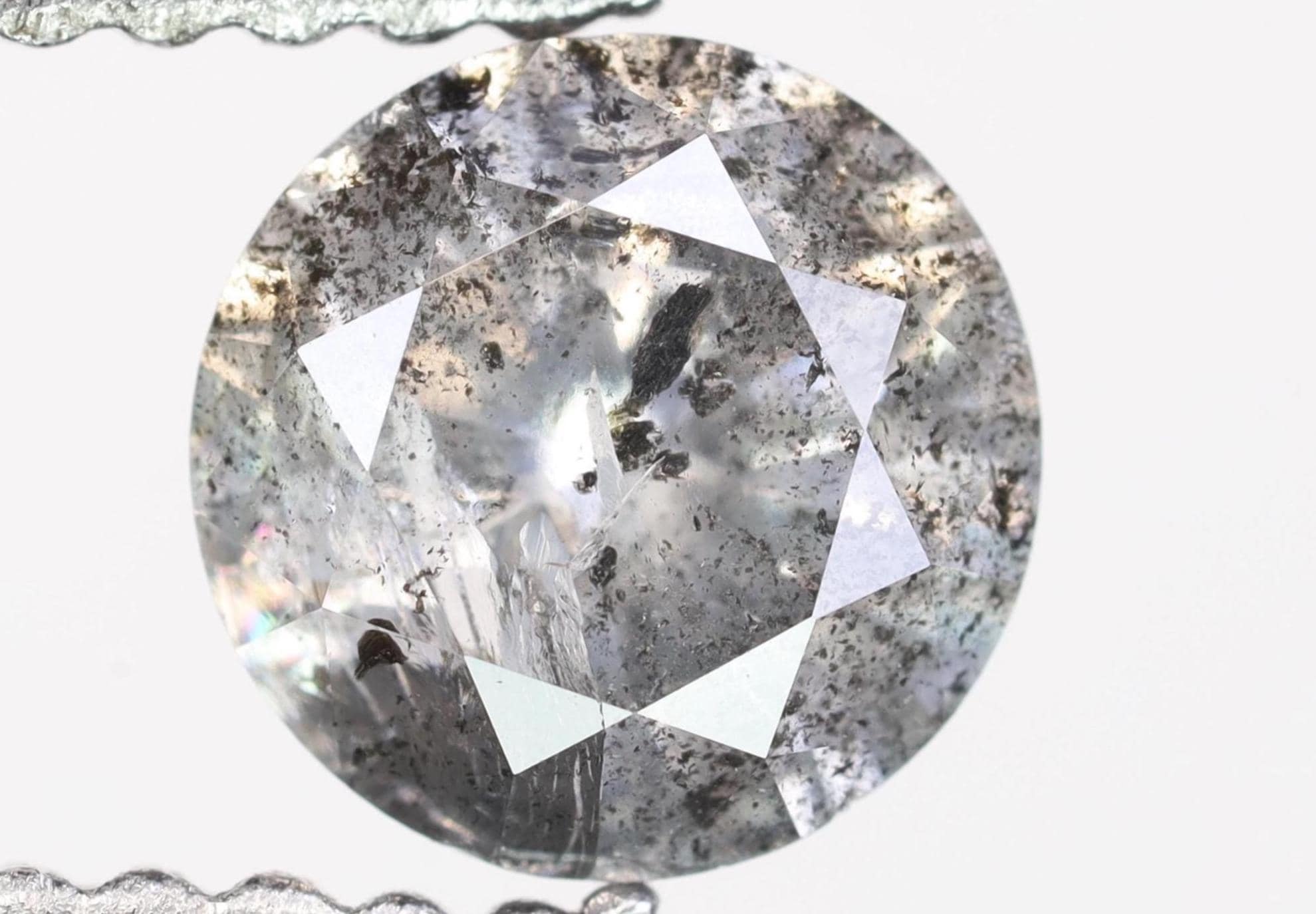 0.66 CT, 5.4 X 3.4 MM, Round Shape Brilliant Cut Fancy Black Salt