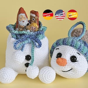 Schneemann Geschenksäckchen mit Christbaumkugel - Amigurumi Häkelanleitung