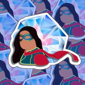 May include: A sticker featuring a cartoon superhero with long black hair, wearing a blue and green costume with a red cape. The superhero is standing in front of a large blue and pink diamond.