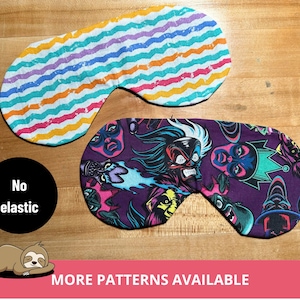 Op de afbeelding: Twee slaapmaskers, een met een regenboogstreepjespatroon en de andere met een paarse achtergrond en een zwart-witte grafische print van verschillende personages. De tekst "No elastic" is zichtbaar in de afbeelding. De tekst "More patterns available" is ook zichtbaar in de afbeelding.