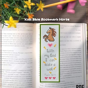 May include: A handmade bookmark with a cross-stitch design. It features a brown horse, the text "With my God I can scale a wall" and Psalm 18:29. The bookmark is on an open book with yellow flowers.