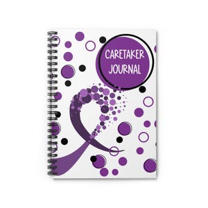 May include: Spiral-bound notebook with a white cover featuring a purple ribbon design and scattered purple and black circles. The text "CARETAKER JOURNAL" is in a purple circle.