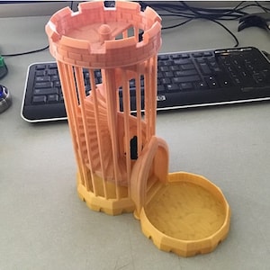 May include: A 3D-printed dice tower in shades of orange and yellow. The tower features a spiral staircase inside and a circular base. The tower is designed to hold and dispense dice. The tower is open on one side to allow the dice to roll out.