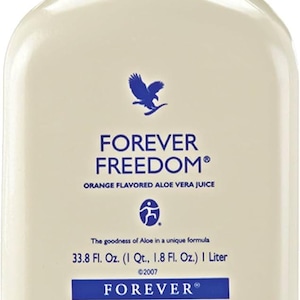 May include: A large, off-white bottle of Forever Freedom orange-flavored aloe vera juice. The bottle has a blue cap and features the Forever Freedom logo with an eagle graphic. The label includes the text "33.8 Fl. Oz. (1 Qt., 1.8 Fl. Oz.) 1 Liter".