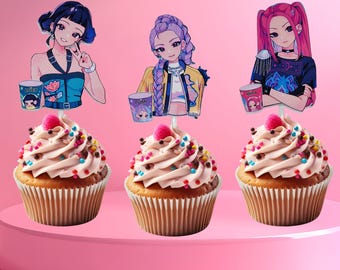 May include: Three cupcakes with pink frosting, sprinkles, and a raspberry on top. Each cupcake has a decorative anime-style character topper. The characters have dark hair and are holding cups. The background is a solid pink.