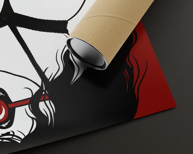 May include: A black and white illustration of a person with a red and white headband, a black rope tied around their head, and a black background. The illustration is printed on a poster that is rolled up and being held by a brown cardboard tube.