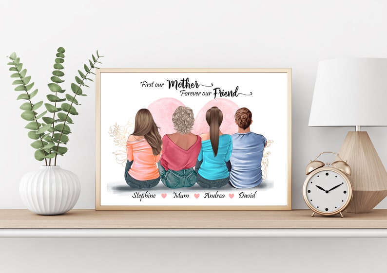 May include: A framed print with a quote that reads "First our Mother, Forever our Friend." The print features an illustration of four people sitting back to back with their names below: Stephanie, Mum, Andrea, and David.