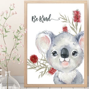 May include: A watercolor illustration of a koala with red flowers and green leaves. The text "Be Kind" is written above the koala.
