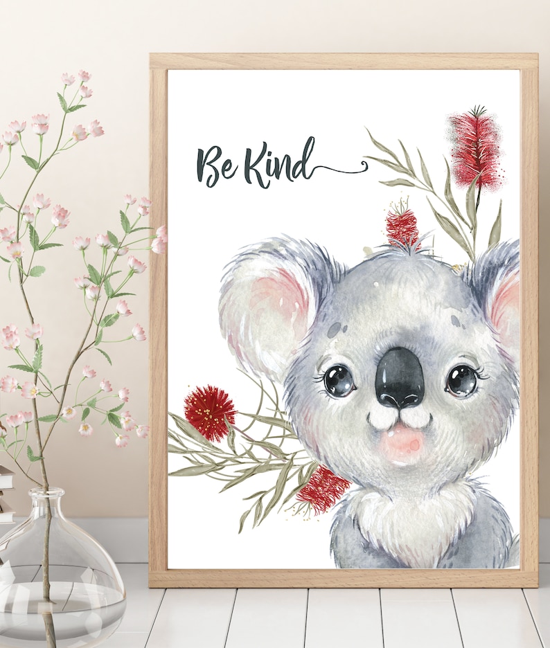 May include: A watercolor illustration of a koala with red flowers and green leaves. The text "Be Kind" is written above the koala.