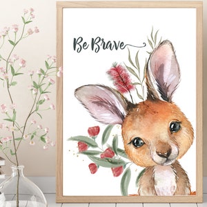 May include: A watercolor illustration of a cute kangaroo with the text "Be Brave" above it. The kangaroo is surrounded by green leaves and red flowers.