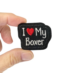 May include: Black felt patch with white embroidery that reads "I love my Boxer" with a red heart in the middle.