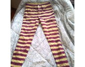 Dyed striped purple and yellow skinny jeans, alternative scenecore punk hippie