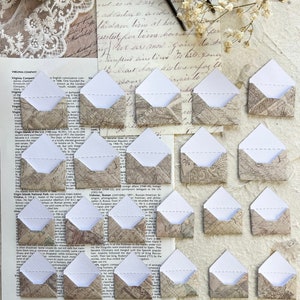 Juego de 10 mini sobres troquelados para crear diarios basura creativos, tarjetas, álbumes de recortes y manualidades con papel.