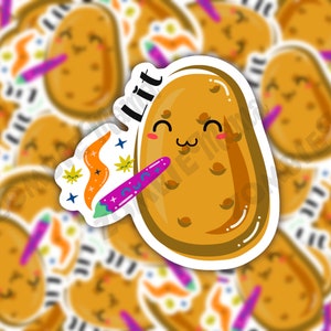 May include: A sticker of a cartoon potato with a smiling face and the word "Litt" above it. The potato is holding a purple and green crayon with a trail of orange and yellow paint behind it.