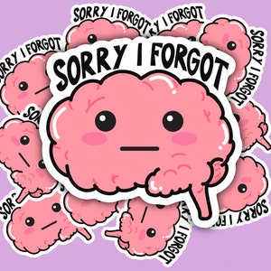 May include: A selection of pink brain-shaped stickers with the text "SORRY I FORGOT" in black. The brain stickers have a cartoon design with black eyes and a neutral expression. The stickers are on a light purple background.