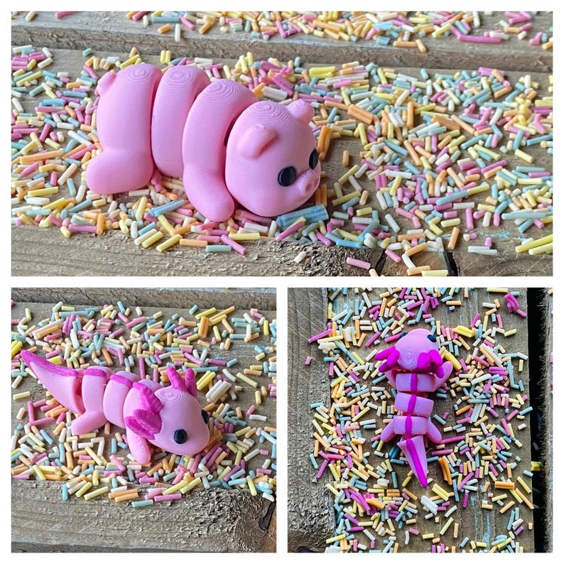 May include: Three pink, segmented, plastic figurines of animals on a background of colorful sprinkles. The figurines are a pig, an axolotl, and a salamander.