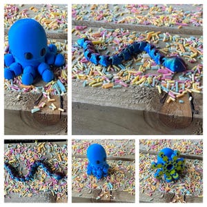 May include: A blue octopus toy with large eyes and eight tentacles. The octopus is surrounded by colorful sprinkles on a wooden surface.