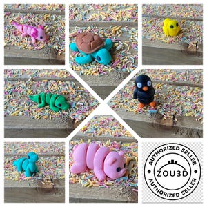 May include: A collection of colorful, handmade polymer clay animal figurines, including an axolotl, turtle, alligator, penguin, chick, caterpillar, and a pig. The figurines are set on a wooden surface covered in colorful sprinkles.