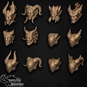 May include: A set of 10 miniature demon heads, sculpted in a detailed, realistic style. The heads are made of a light brown resin and feature various horns, ears, and facial expressions.