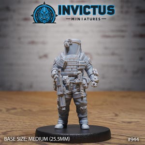 May include: A gray miniature figure of a soldier in a protective suit, standing on a black base. The figure has detailed armor, a helmet with a visor, and is equipped with weapons and gear. The base size is medium, 1 inch. The Invictus Miniatures logo is visible.