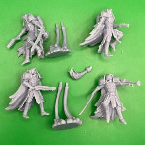 May include: Five gray plastic miniature figures of warriors with swords and guns. The figures are posed in various fighting stances. There are also two sets of gray plastic miniature legs.